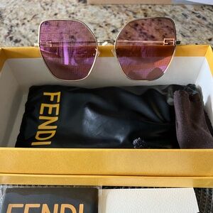 Fendi Sunglasses- Light pink lenses/Gold tone frame with Fendi logo.
